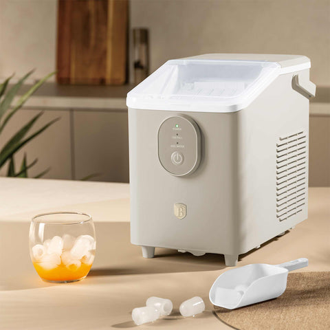 Product image of Ice cube maker. Part of the Sahara Collection . Features: • Power: 120W • Voltage: 220-240V, 50/60Hz • 0,8L water tank • Accessories: • Ice scoop • Ice basket • Length of power cord: 1,2 m • Color: cream. (Studio view). Official Berlinger Haus product, boosted by Promintra sl.