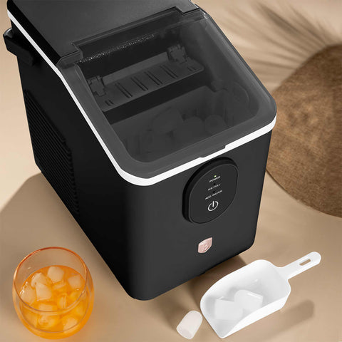 Product image of Ice cube maker. Part of the Black Rose Collection . Features: • Power: 120W • Voltage: 220-240V, 50/60Hz • 0,8L water tank • Accessories: • Ice scoop • Ice basket • Length of power cord: 1,2 m • Color: black- .... (Studio view). Official Berlinger Haus product, boosted by Promintra sl.