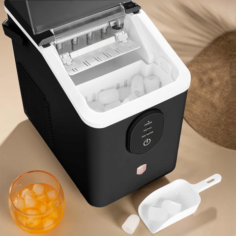 Product image of Ice cube maker. Part of the Black Rose Collection . Features: • Power: 120W • Voltage: 220-240V, 50/60Hz • 0,8L water tank • Accessories: • Ice scoop • Ice basket • Length of power cord: 1,2 m • Color: black- .... (Studio view). Official Berlinger Haus product, boosted by Promintra sl.