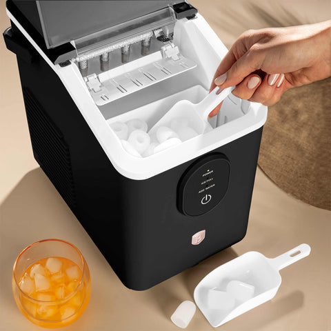Product image of Ice cube maker. Part of the Black Rose Collection . Features: • Power: 120W • Voltage: 220-240V, 50/60Hz • 0,8L water tank • Accessories: • Ice scoop • Ice basket • Length of power cord: 1,2 m • Color: black- .... (Studio view). Official Berlinger Haus product, boosted by Promintra sl.