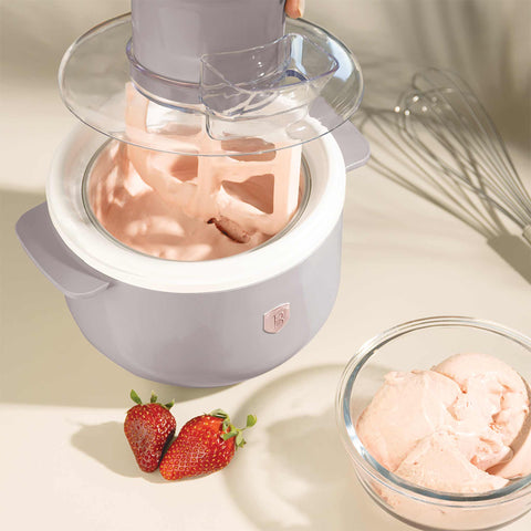 Product image of Ice cream maker. Part of the Taupe Collection . Features: • Material: aluminium, plastic • 220-240V 50/60Hz 12W • Capacity: 1,1L • Include: • Aluminium bowl • Stirring paddle • Size: 22,7*18,6*21.2 cm • Le.... (Studio view). Official Berlinger Haus product, boosted by Promintra sl.