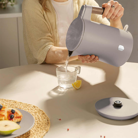Product image of Double wall kettle. Part of the Taupe Nordic Collection . Features: • Material: 18/10 stainless steel inside, plastic outside • Capacity: 1,7L • Voltage: 220-240V, 50/60Hz • Power: 2200 W • Size: 23*16*25 cm • Lengt.... (Studio view). Official Berlinger Haus product, boosted by Promintra sl.
