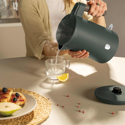 Product image of Double wall kettle. Part of the Matte Green Collection . Features: • Material: 18/10 stainless steel inside, plastic outside • Capacity: 1,7L • Voltage: 220-240V, 50/60Hz • Power: 2200 W • Size: 23*16*25 cm • Lengt.... (Studio view). Official Berlinger Haus product, boosted by Promintra sl.