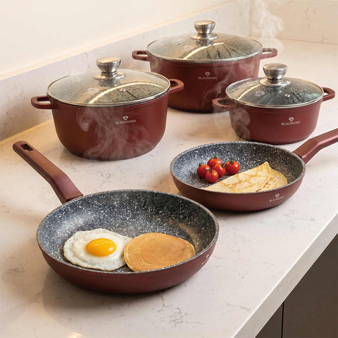 Product image of 8pcs cookware set. Part of the Blaumann/Cera Stone Collection . Features: • Material: cast aluminum • Include: • Frypan Ø24*4,5 cm 1,5L • Frypan Ø28*5 cm 1,5L • Casserole with lid Ø20 cm 2,3L • Casserole with lid Ø24 cm 4.... (Studio view). Official Berlinger Haus product, boosted by Promintra sl.