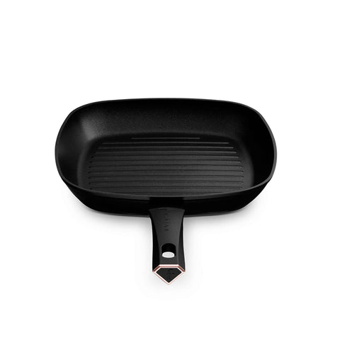 Product image of Grill pan 28cm. Part of the MATTE BLACK- ROSE GOLD . Features: • Material: forged aluminum with non-stick titanPro coating • Grill pan Ø28*4,1 cm 2,1L • Color: matt black- rose gold. (Studio view). Official Berlinger Haus product, boosted by Promintra sl.