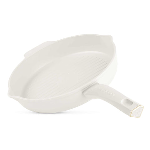 Product image of Round grill pan with 2mouth 26cm. Part of the MATTE CREAM- GOLD . Features: • Material: forged aluminum with non-stick titanPro coating • Grill pan Ø26 cm • Color: matt cream- gold. (Studio view). Official Berlinger Haus product, boosted by Promintra sl.