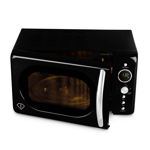 Product image of Digital microwave oven 20L. Part of the MATTE BLACK- ROSE GOLD . Features: • Input power: 1200W/ 2450 MHz • Output power: 700W • Capacity: 20L • Glass plate: Ø24,5 cm • Length of power cord: 100 cm • Color: black- rose gold. (Studio view). Official Berlinger Haus product, boosted by Promintra sl.