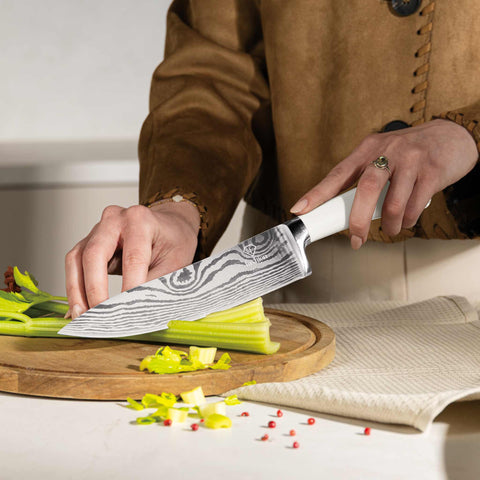 Product image of 6pcs knife set with stand. Part of the MATTE CREAM- GOLD . Features: • Material: stainless steel • Chef knife 20 cm • Bread knife 20 cm • Santoku knife 17,5 cm • Utility knife 12,5 cm • Paring knife 9 cm • Stand • Co.... (Studio view). Official Berlinger Haus product, boosted by Promintra sl.