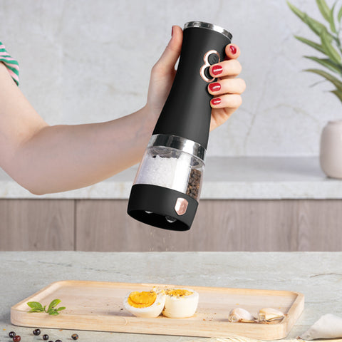 Product image of 2in1 electric pepper and salt mill. Part of the Black Rose Collection . Features: • Material: stainless steel with CERAMIC grinder • Batteries: 4 pcs AA (not inc.) • Color: black- rose gold. (Conceptual view). Official Berlinger Haus product, boosted by Promintra sl.