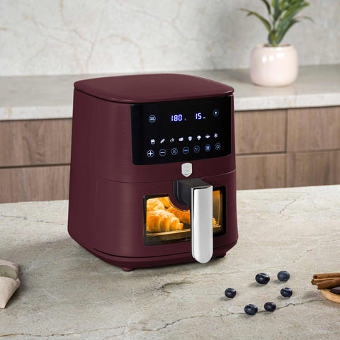 Product image of Air fryer 5L visible window. Part of the Leonardo Collection . Features: • Power: 220-240V ~ 1400W • Temperature control: 40-200℃ • Include: • XL SIZE: food basket with non-stick coating 5L • DIGITAL • Color: matt bordeaux. (Studio view). Official Berlinger Haus product, boosted by Promintra sl.