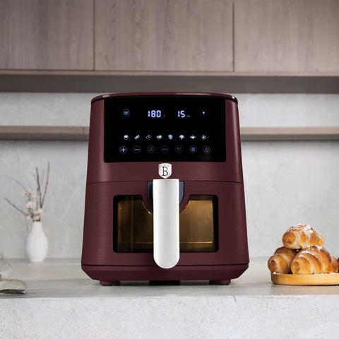 Product image of Air fryer 5L visible window. Part of the Leonardo Collection . Features: • Power: 220-240V ~ 1400W • Temperature control: 40-200℃ • Include: • XL SIZE: food basket with non-stick coating 5L • DIGITAL • Color: matt bordeaux. (Studio view). Official Berlinger Haus product, boosted by Promintra sl.